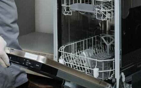 Dishwasher Repair in Downtown technician fixing a dishwasher