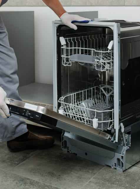 Dishwasher Repair in Downtown technician fixing a dishwasher