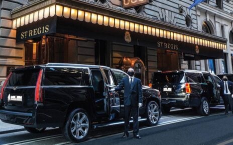 Professional driver assisting passengers during a Miami Airport to Port of Miami transfer.