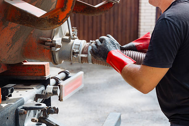 Wrench being used for garbage disposal repair in Downtown kitchen sink