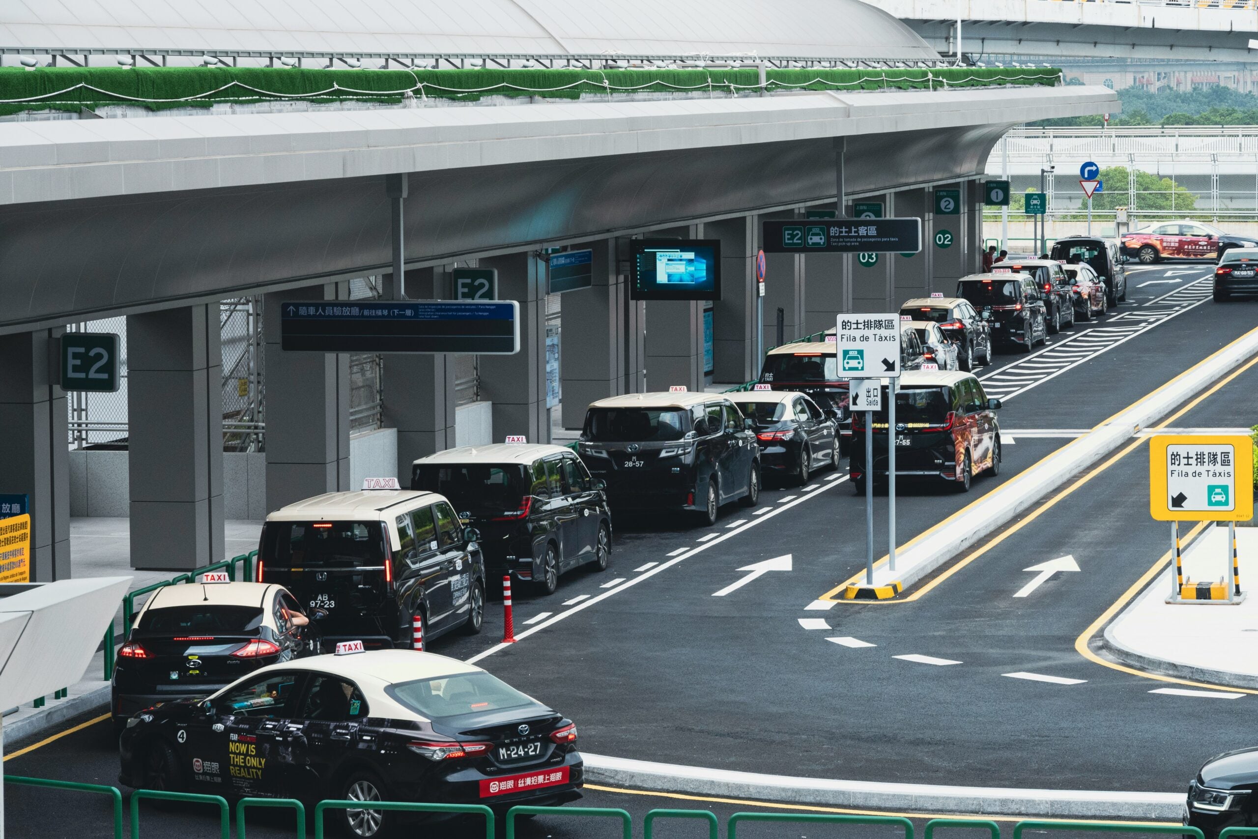 Taxi and shuttle vehicles ready for airport pickups